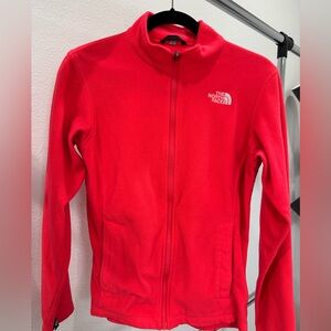 The North Face Girls Fleece Sweater XL. Some signs of wear in color. Orange.